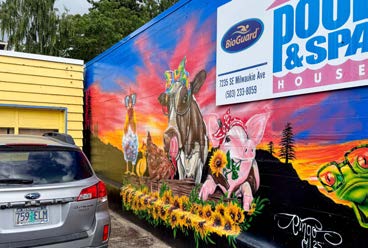 Building exterior mural with The Pool and Spa House signage