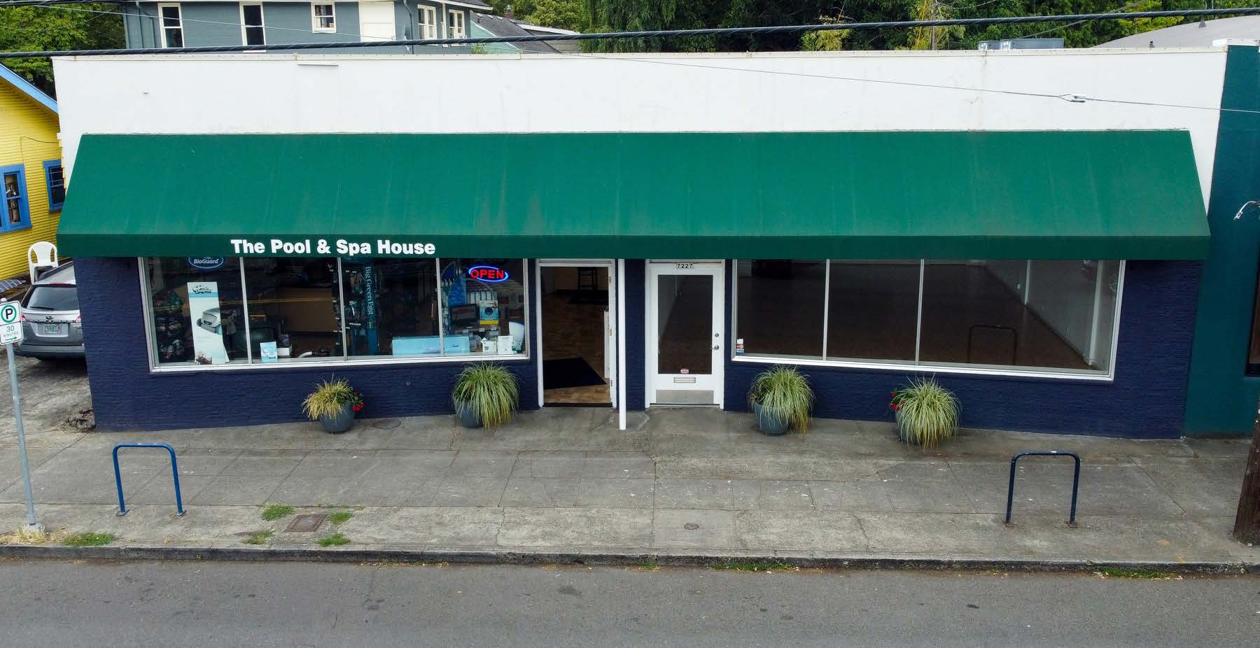 Storefront of 7227 SE Milwaukie Ave with full-width glass line and awning signage
