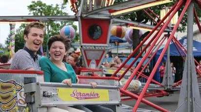Riders on the Scrambler at Oaks Amusement Park
